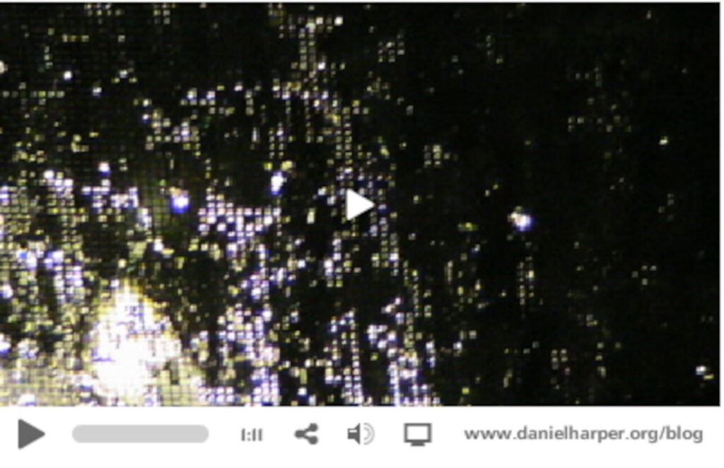 Screen grab from the video showing rain on a windowscreen.