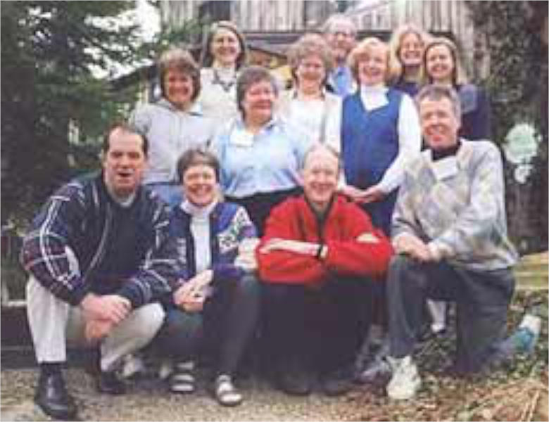 A low resolution photo of 12 people posing