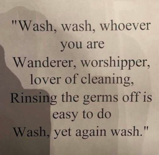 Sign saying Wash, wash whoever you are...