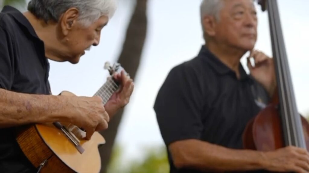 Two men playing musical instruments